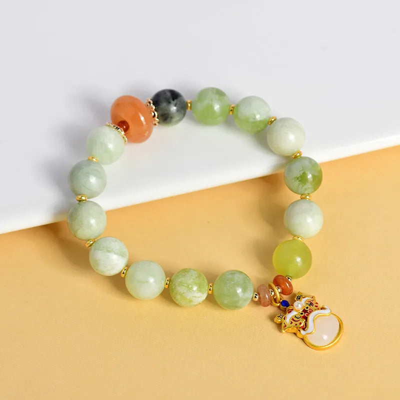 Green milk-in-water Xingshi pendant on handmade jade bracelet with 10mm geometric beads