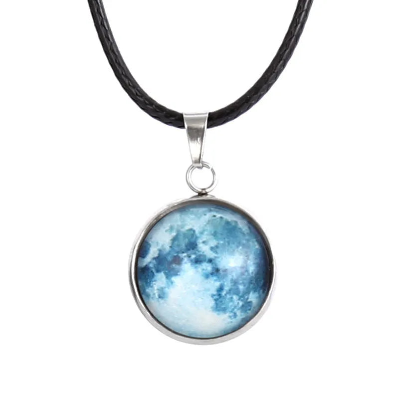 Luminous constellation glass pendant necklace with a moon and night sky design on an adjustable chain