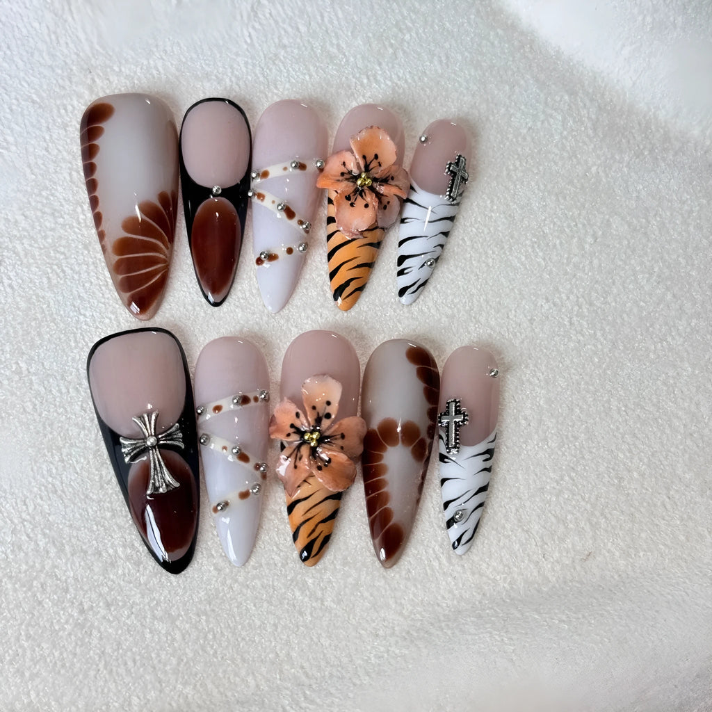 Ten artificial nail stickers with leopard print, cross, and floral patterns in French style design