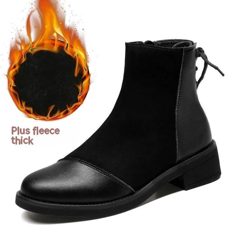 Black women's side-zip Martin boots with a round toe and short heel on a non-slip sole.