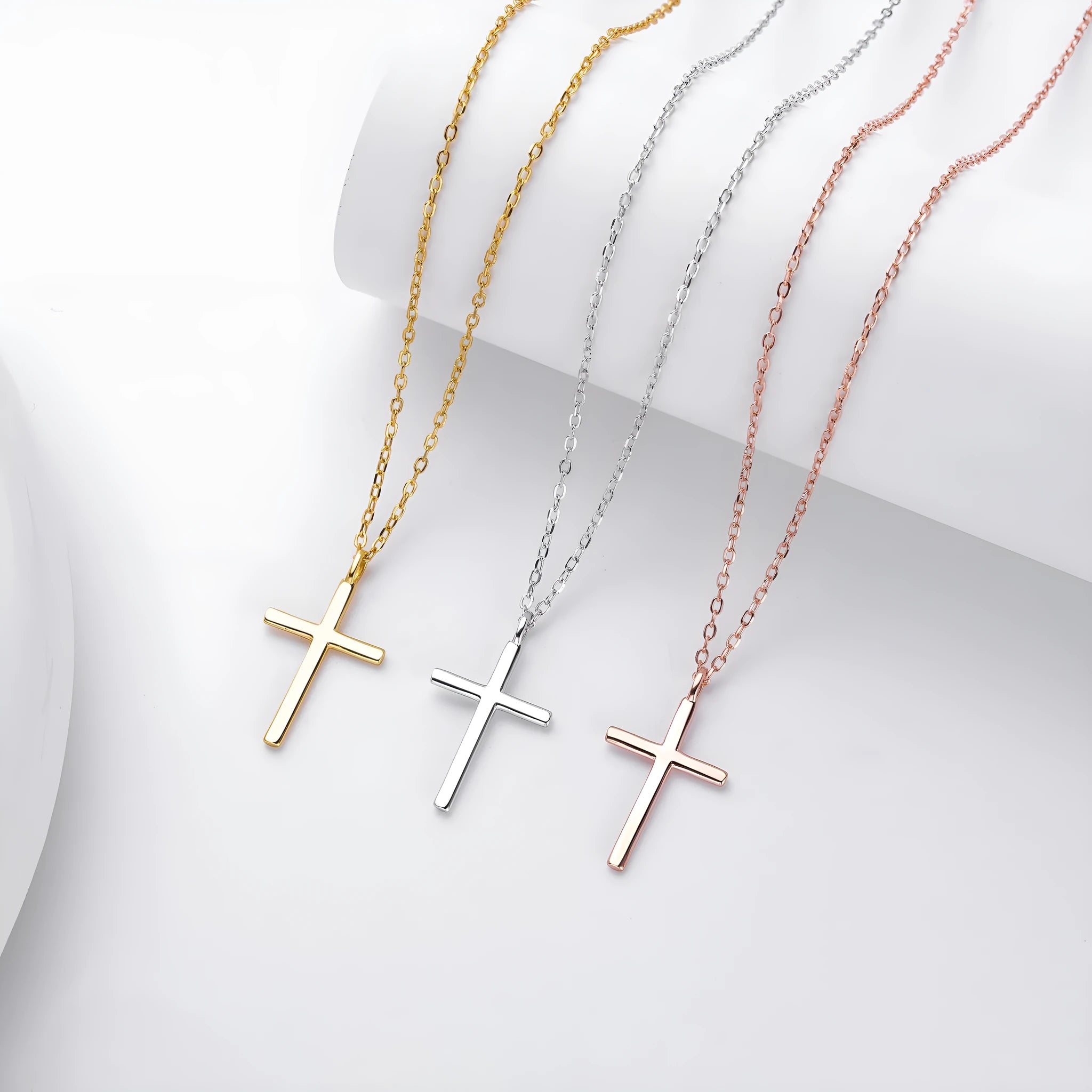 Sterling silver cross pendant necklace on O-shaped chain with gold, platinum, and rose gold plating options