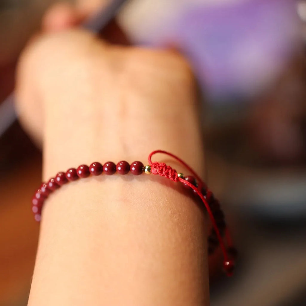 Handmade natural cinnabar bracelet with purple gold sand design and geometric Chinese auspicious patterns