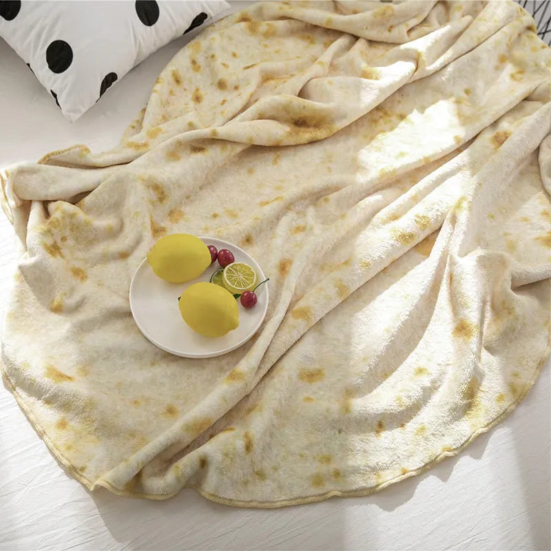 Round coral fleece burrito blanket with printed design on soft flannel fabric.