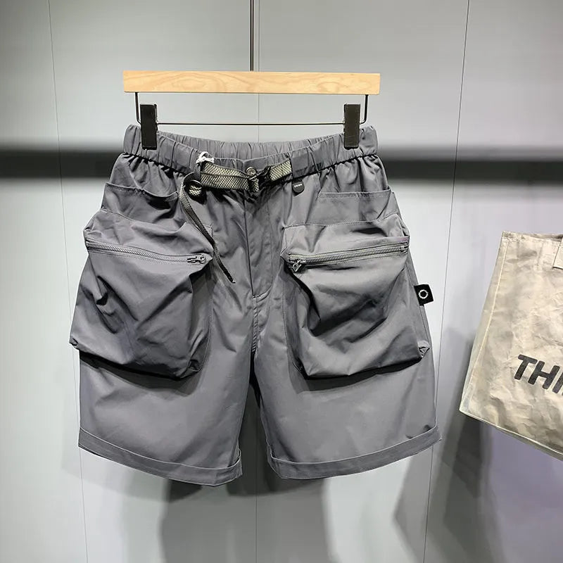 Men's black workwear shorts with pockets, loose fit, and straight leg hem