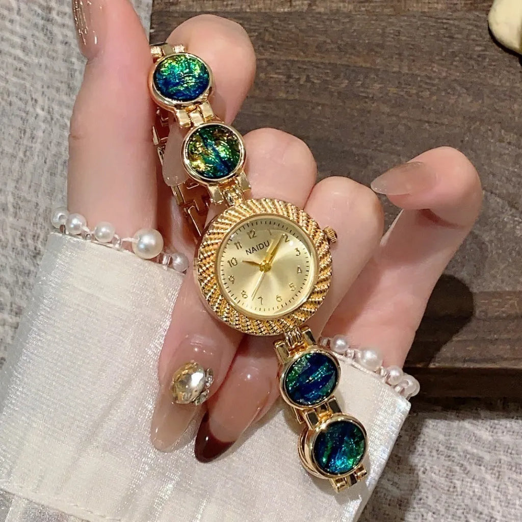 Women's round 25mm quartz watch with zinc alloy case in one of six colour options.