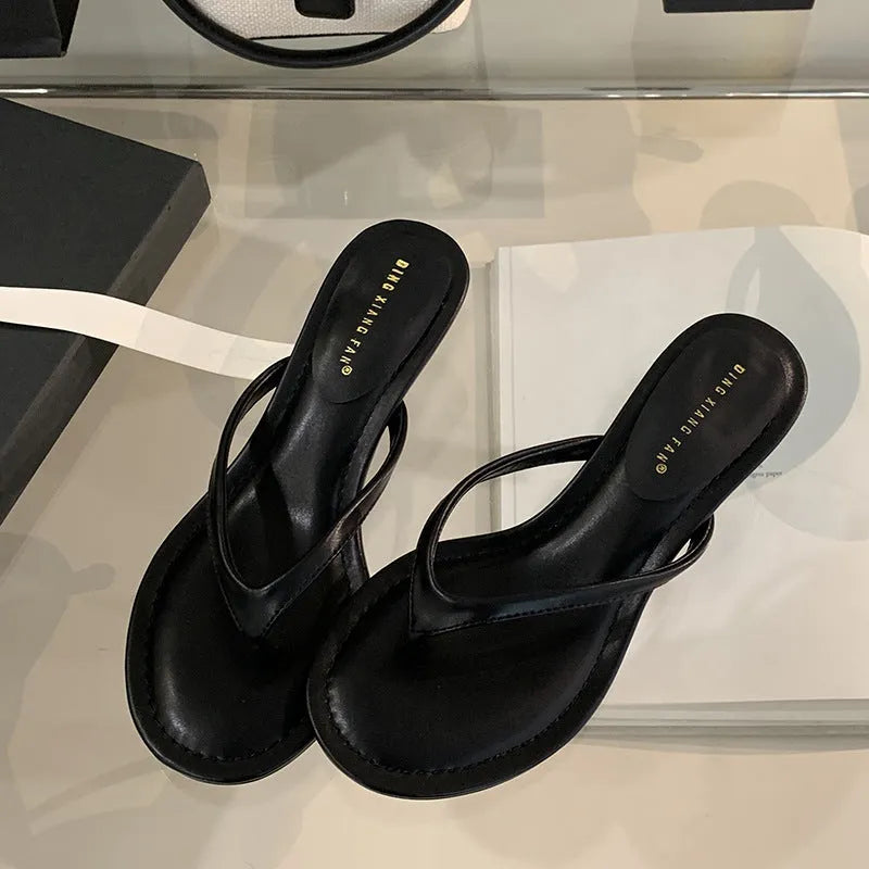 Women's simple round toe stiletto sandals in rubber, shown in classic black and sheepskin camel colours.