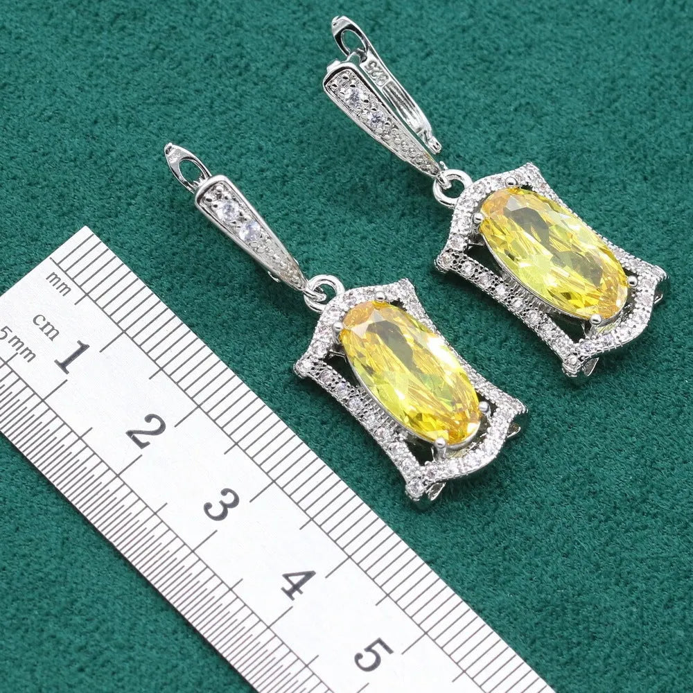 Yellow and olive anti-allergy zircon jewellery set with necklace, earrings, ring, and bracelet on a snake bone chain.