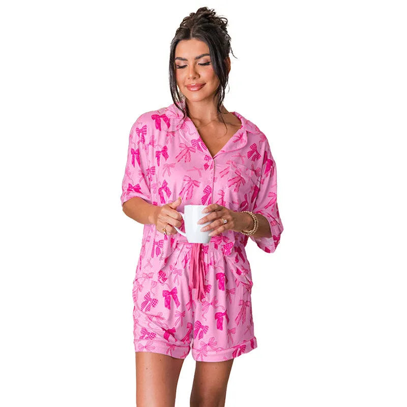 Pink bow print polyester pajama set with matching top and trousers for women