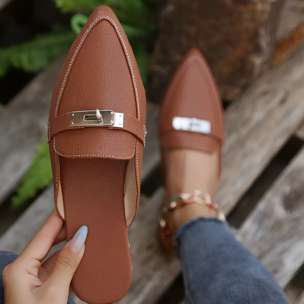 Light brown women's pointed-toe low heel semi-slippers with a rubber sole.