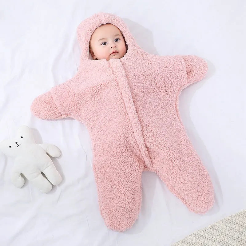 Baby lamb velvet starfish sleeping bag in khaki, hooded with zip and cuffs, lying flat on a surface