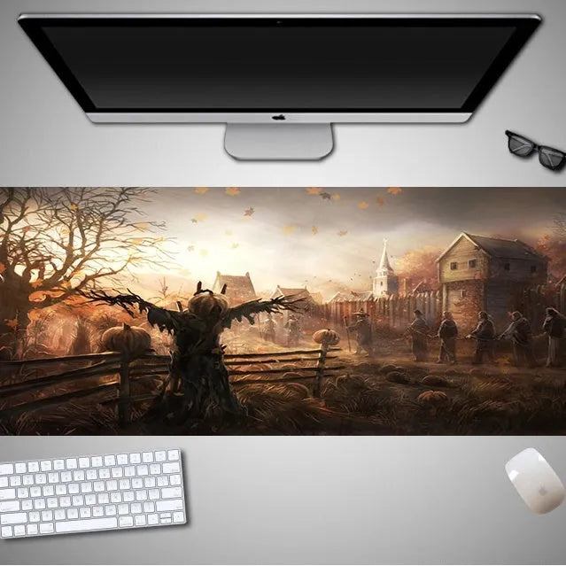 Oversized Halloween-themed computer mouse pad with non-slip rubber cloth backing on wooden desk