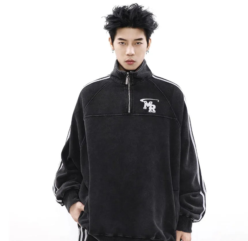 Black Hong Kong style polyester sports hoodie with stand collar and long sleeves on a hanger.