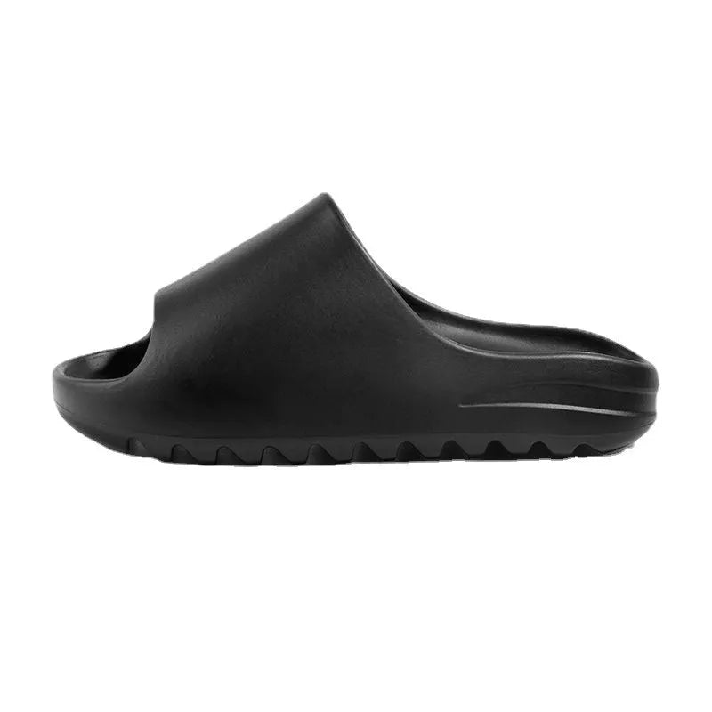 A pair of women's thick-sole beach slippers in a choice of colours, shown on a sandy background.