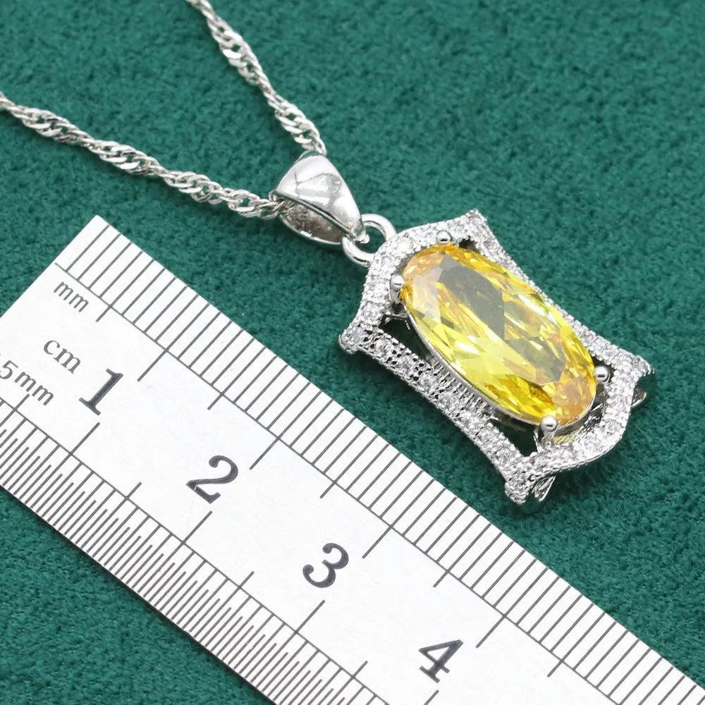 Yellow and olive anti-allergy zircon jewellery set with necklace, earrings, ring, and bracelet on a snake bone chain.