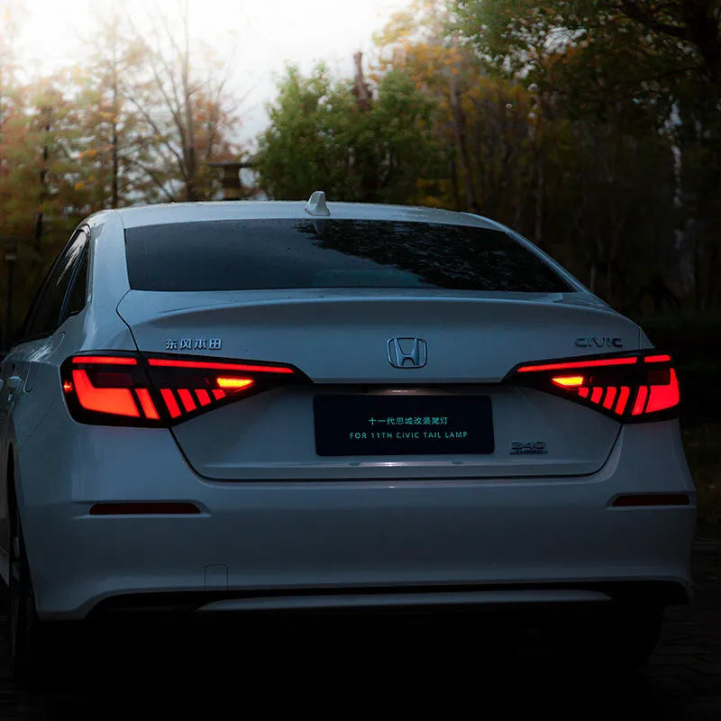 11th generation Honda Civic black and red LED tail light assembly with sequential indicators
