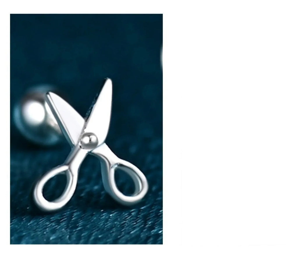 A pair of pure silver screw style ear nails with a miniature scissors design