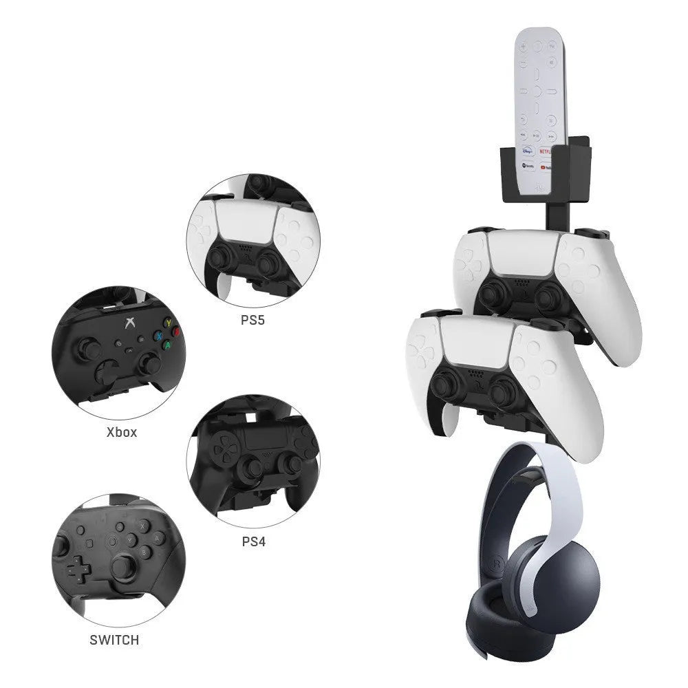 White wall-mounted plastic hook holding a game controller and a pair of headphones.