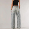 Women's loose fit cotton wide leg trousers in blue with low waist and splicing stitch detail.