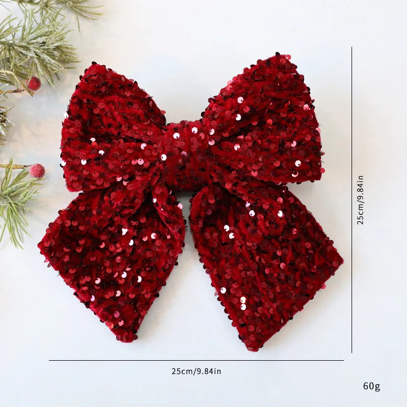 Polyester 25cm red paillette sequin bow Christmas decoration pendant hanging on a white background