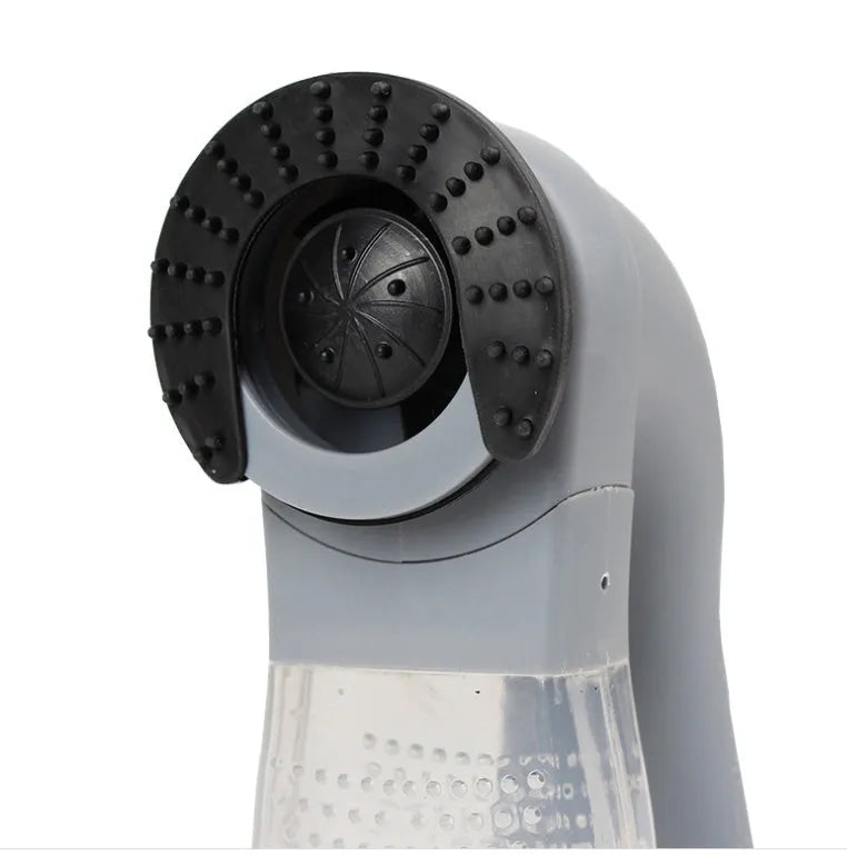 Grey portable electric pet hair vacuum cleaner with soft rubber grooming head.