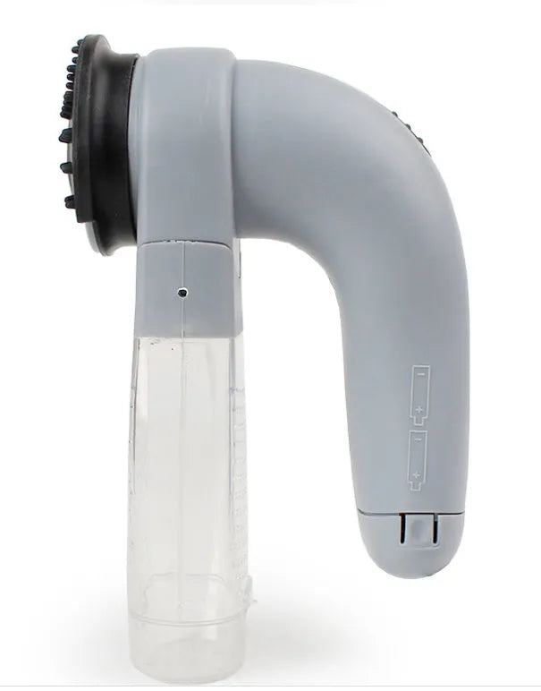 Grey portable electric pet hair vacuum cleaner with soft rubber grooming head.