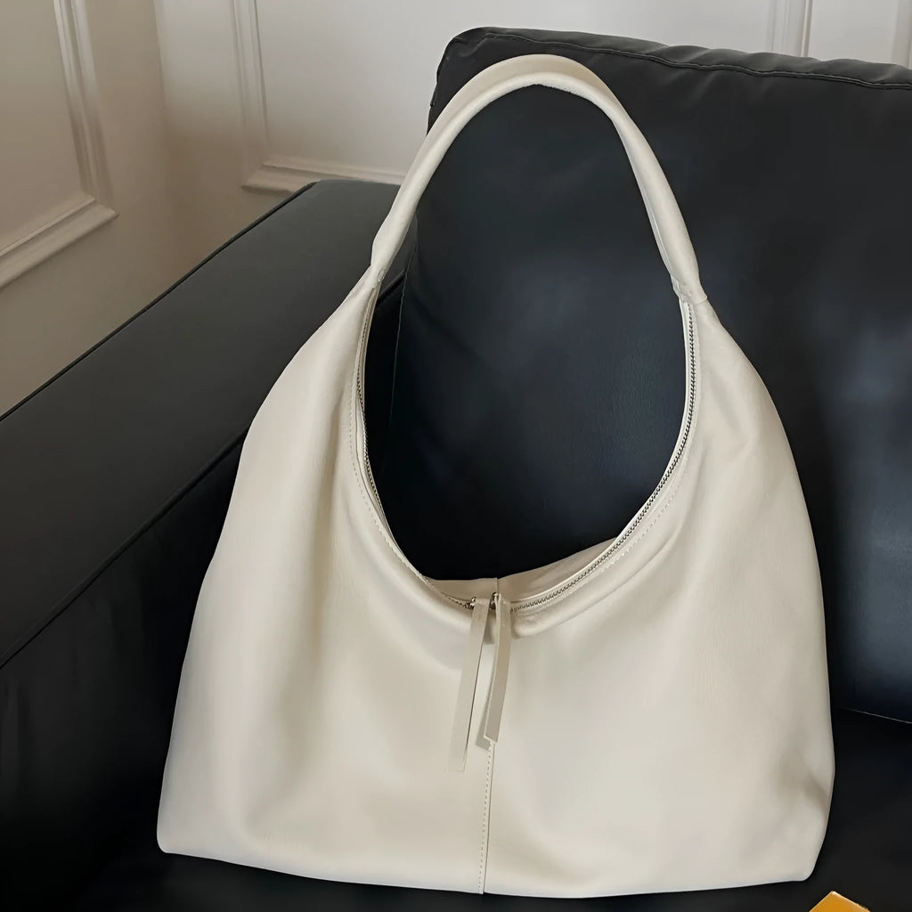 Genuine leather crescent underarm bag in ankarat red with sandwich pocket and single shoulder strap