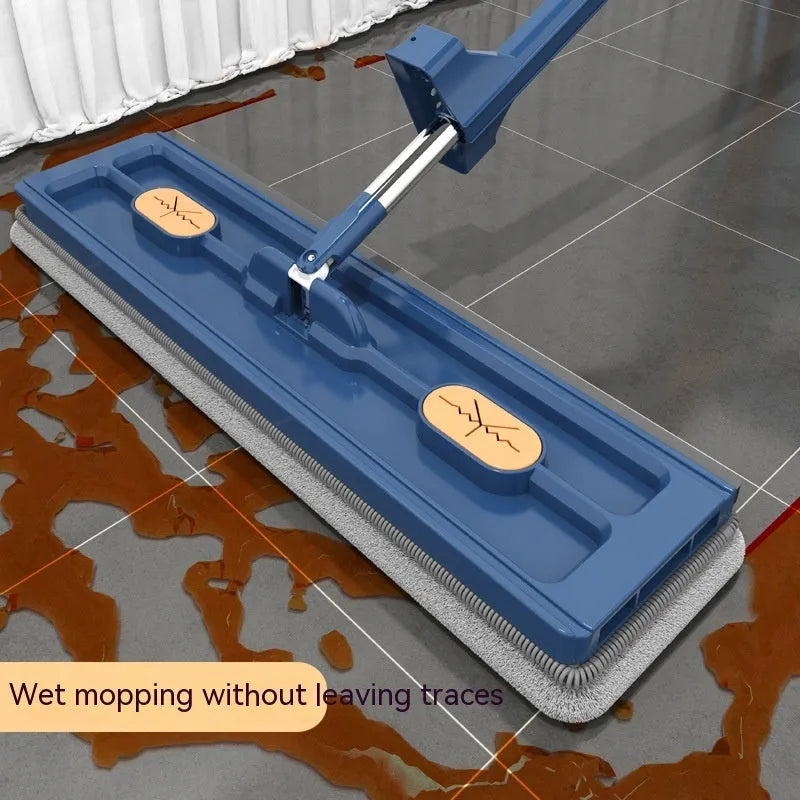 Large blue flat mop with long stainless steel handle and rotating head shown on hard floor