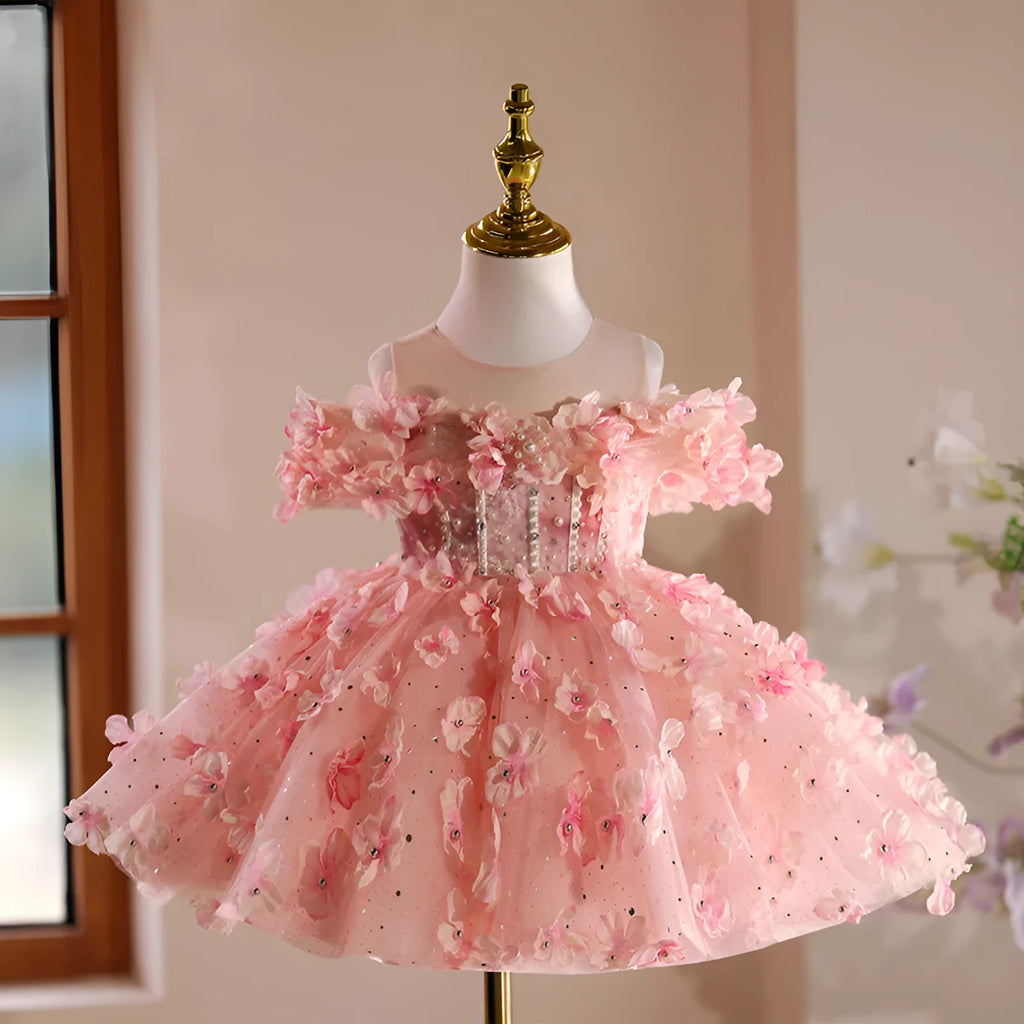 Girls pink polyester pettiskirt princess style dress on white background showing full skirt shape
