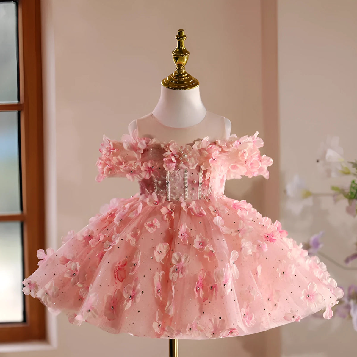 Girls pink polyester pettiskirt princess style dress on white background showing full skirt shape