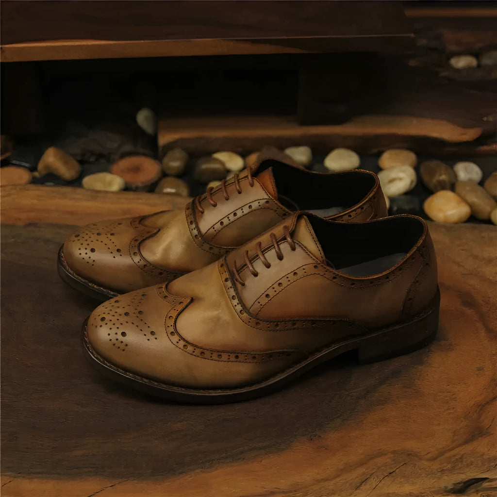 Light brown men's vintage engraved leather lace-up shoes with round toe.