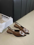 Women's low heel closed toe sandals in apricot with a pointed toe and back strap.