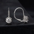 Sterling silver flower bud clip earrings with moissanite centre stone and white gold plating
