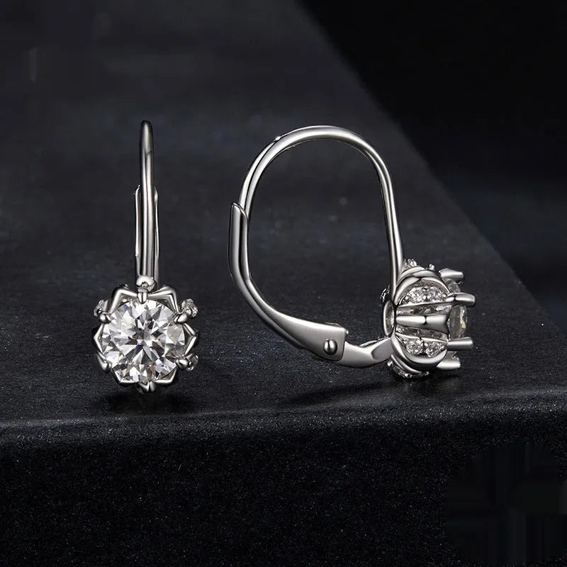Sterling silver flower bud clip earrings with moissanite centre stone and white gold plating