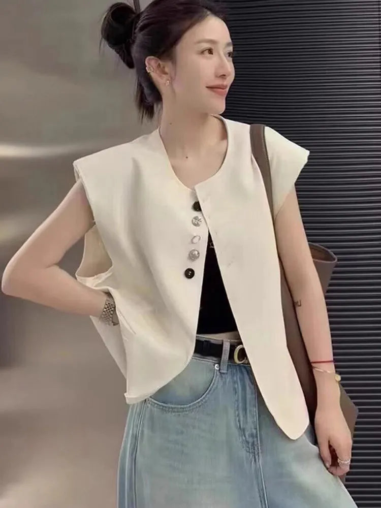 Women's milky white loose-fit polyester vest with pockets, shown with a short 40cm length.