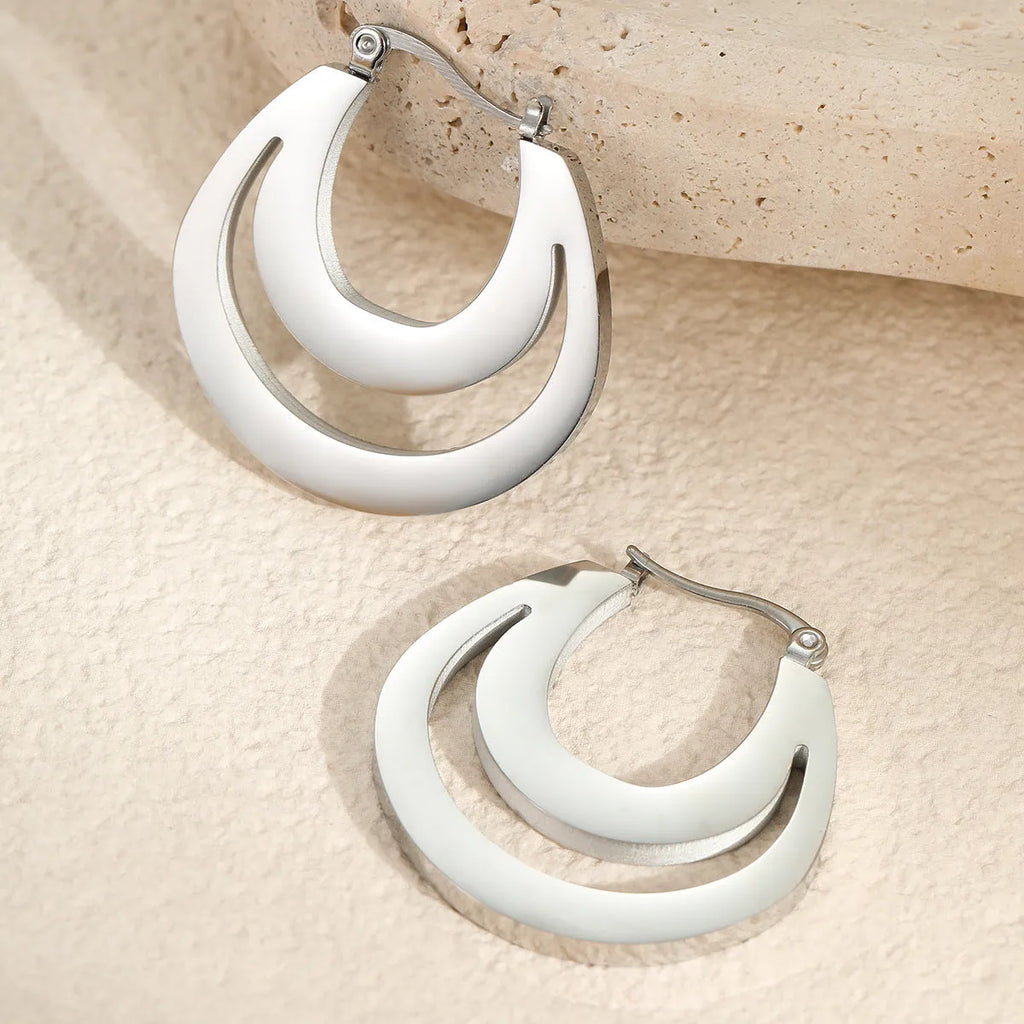 Geometric French minimalist earrings in gold or steel plating with circular ring design