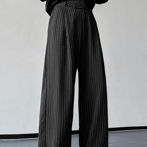 Black men's trousers with vertical stripes and pleated design featuring elastic waistband