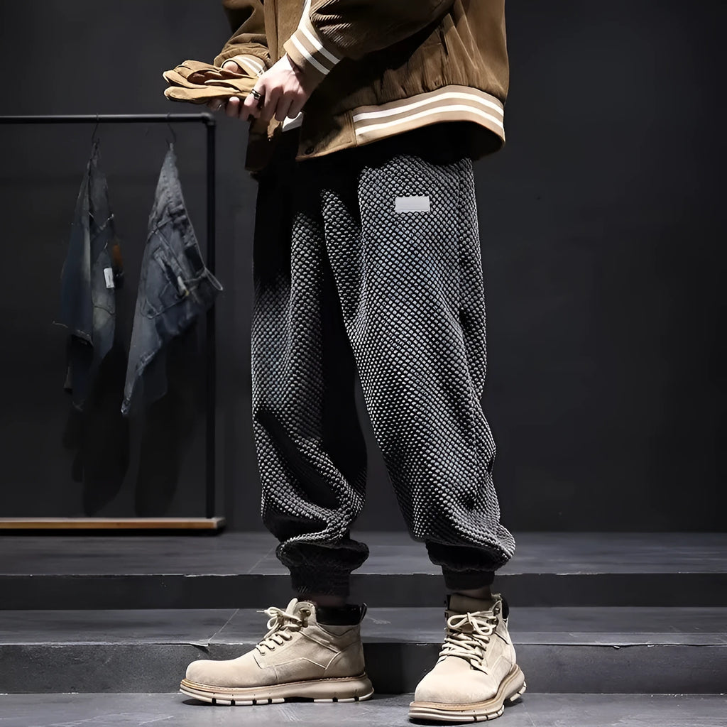 Men's grey casual sweatpants with ankle tie detail showing straight-leg silhouette