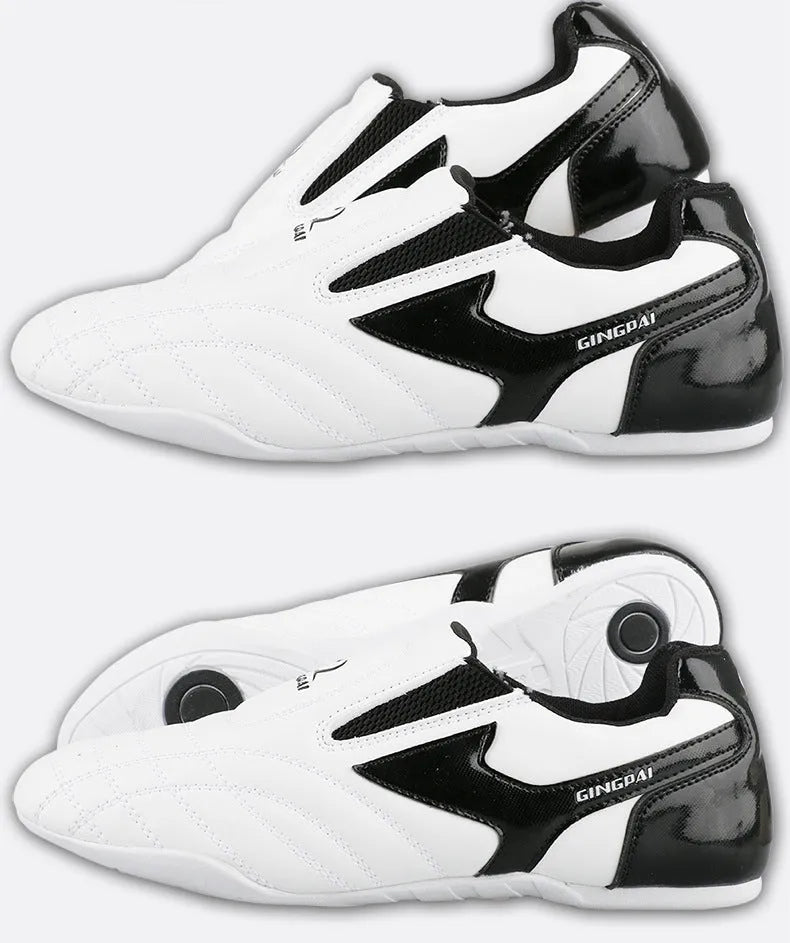 Black and white children's martial arts training shoes with soft bottom construction and widened design