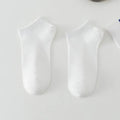 Men's solid colour polyester boat socks in low-cut design showing six colour variations