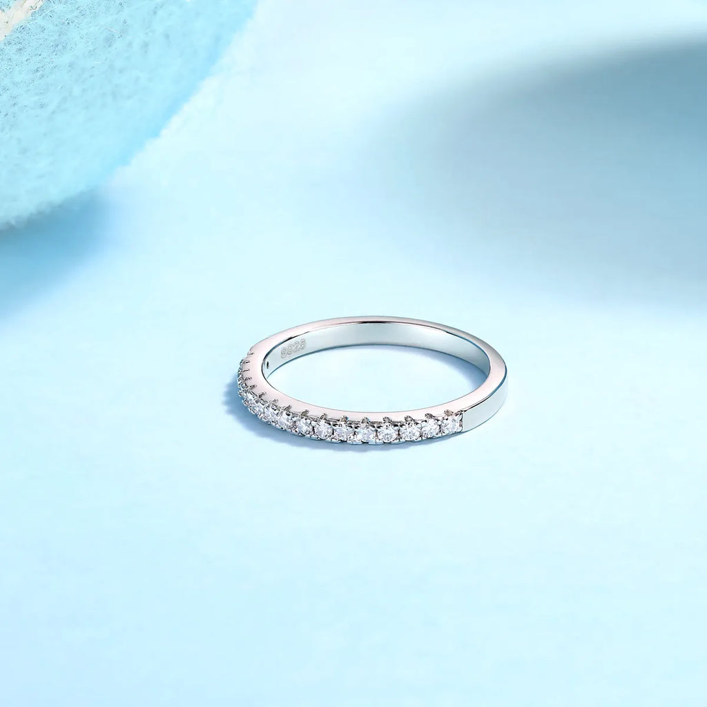Parallel World moissanite wedding ring set in gold and rose gold on a gift box