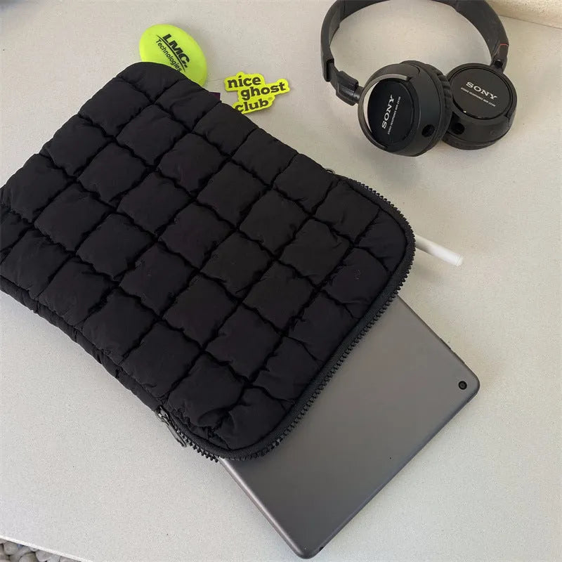 Black nylon laptop backpack open to show dedicated computer compartment with cloud cotton shoulder straps