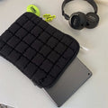 Black nylon laptop backpack open to show dedicated computer compartment with cloud cotton shoulder straps
