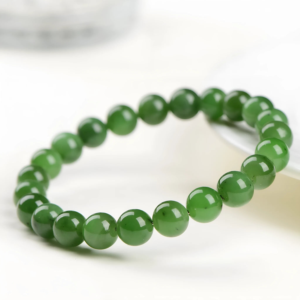 Natural jasper ball bracelet with polished round jade beads on a single strand, showing different bead size options.
