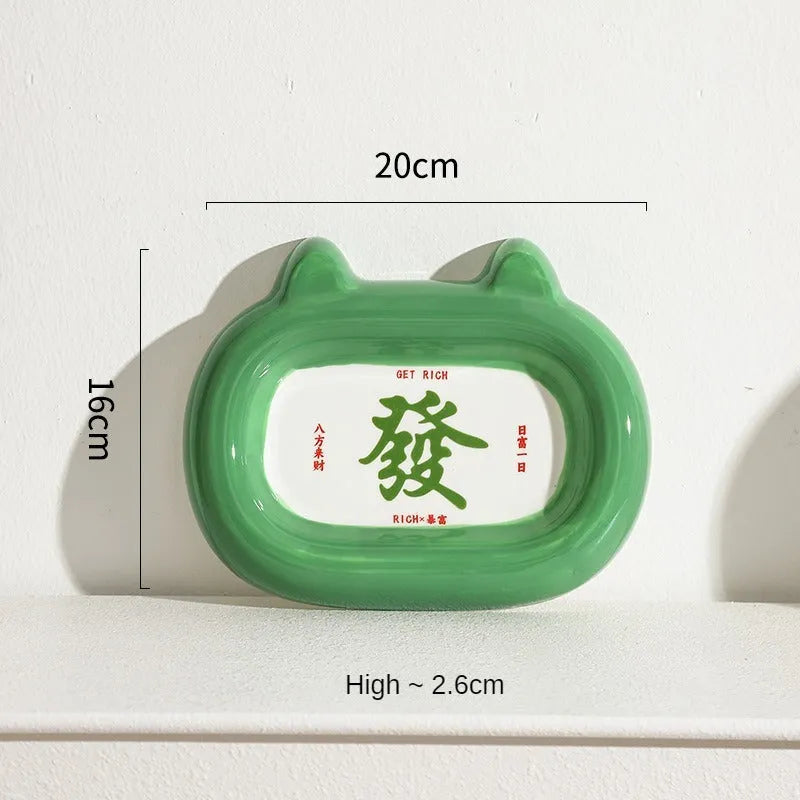 White ceramic pet bowl with raised sides featuring a colourful cai wealth character design for cat or dog food and water