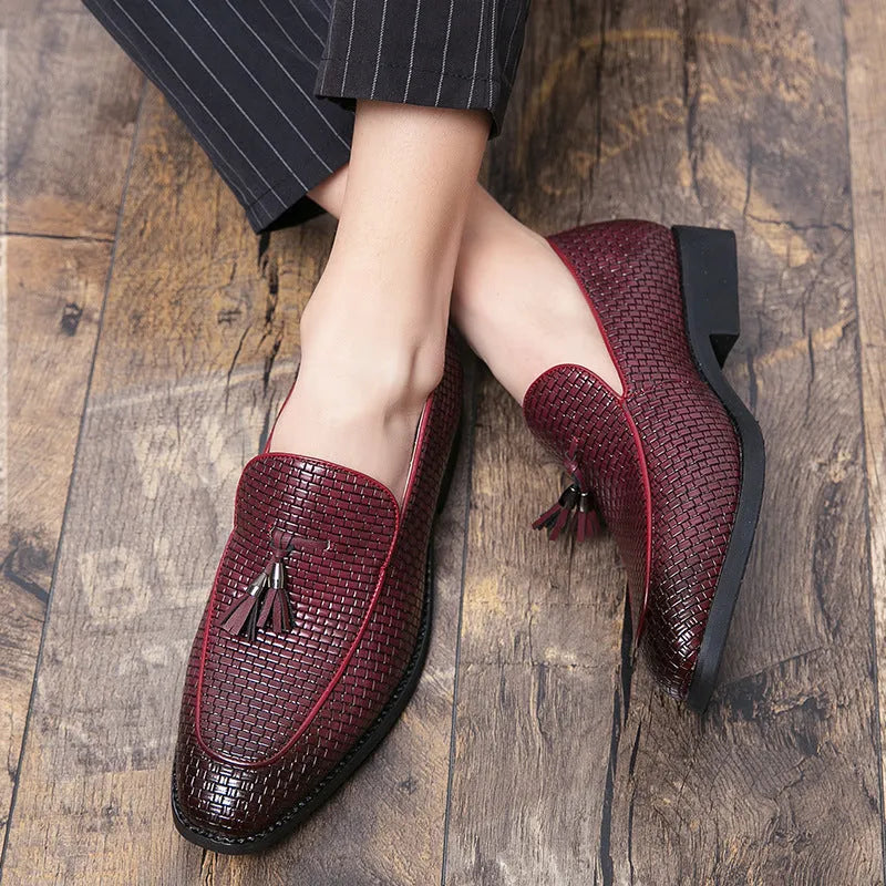 Men's black pointed toe slip-on loafers with a tassel detail on the artificial PU upper.