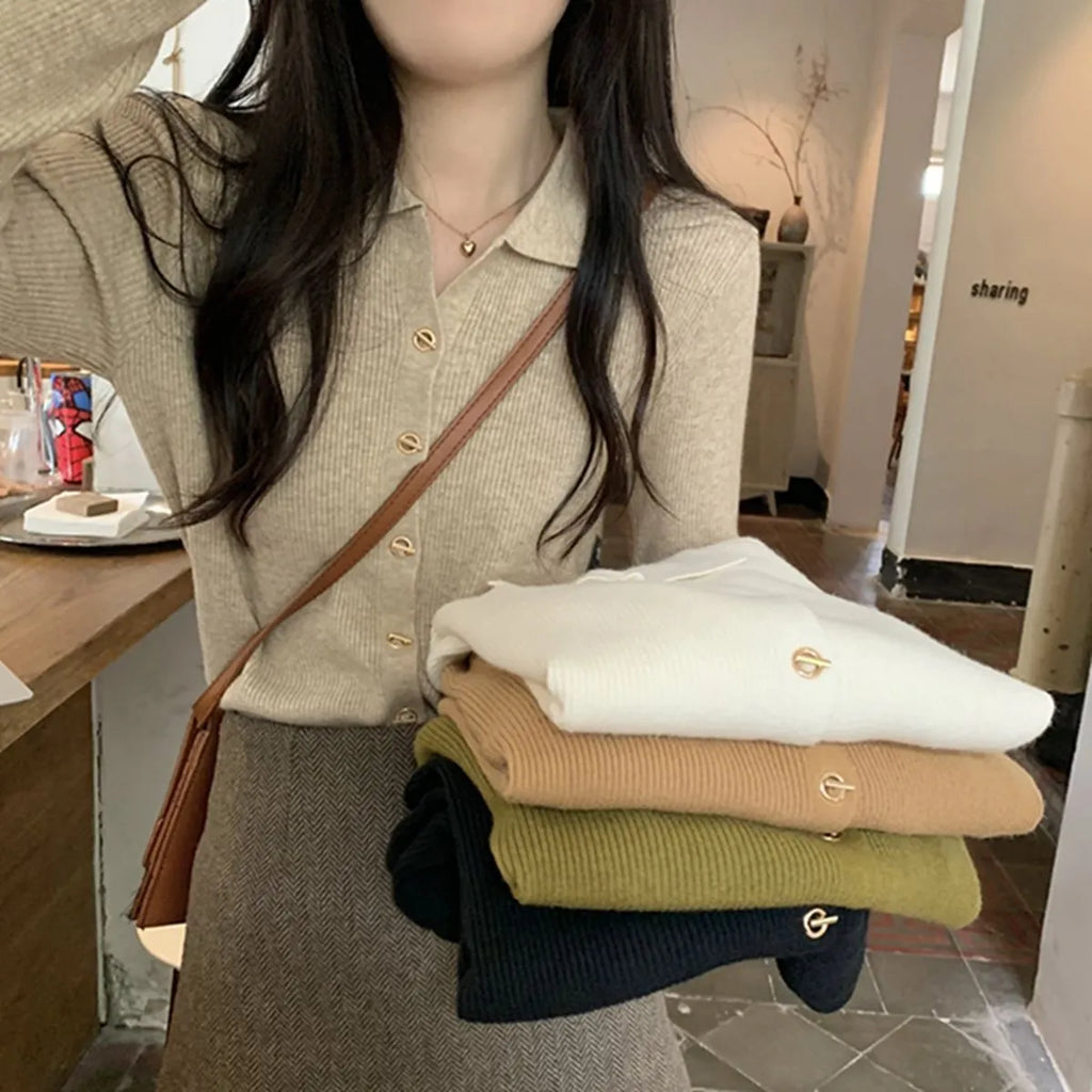 Beige loose-fit long-sleeve viscose knitted cardigan shown on a hanger.