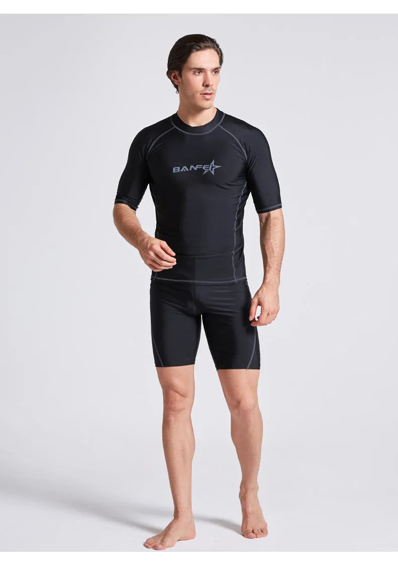 Men's half-sleeve nylon swimsuit set in blue for snorkelling and surfing with matching top and pants