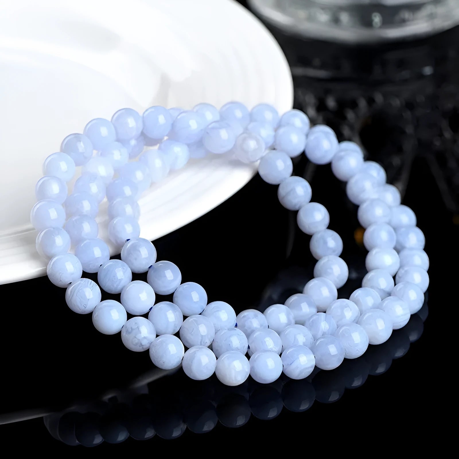 Natural blue agate bracelet with multi-circle patterns and scattered Ruyi elements on wrist