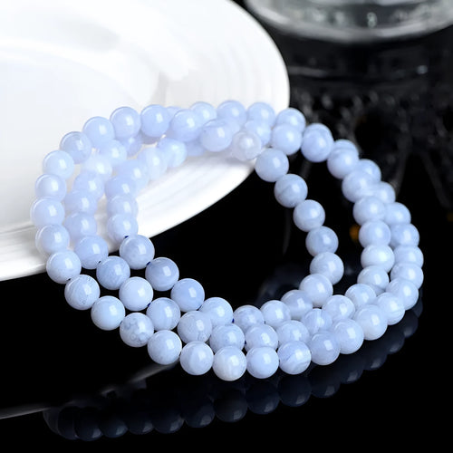 Natural blue agate bracelet with multi-circle patterns and scattered Ruyi elements on wrist