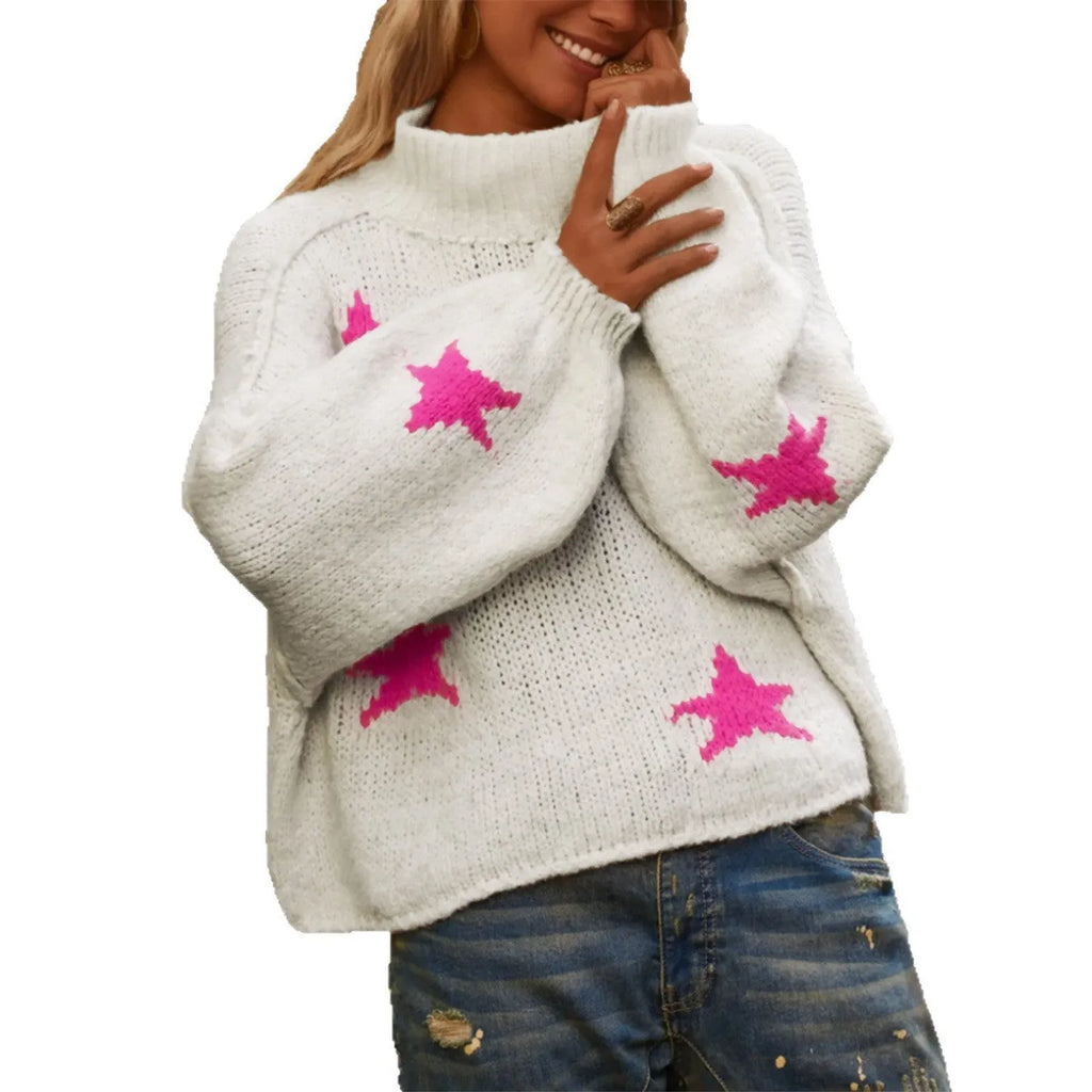 White women's loose turtleneck sweater with a large black five-pointed star pattern on the front.